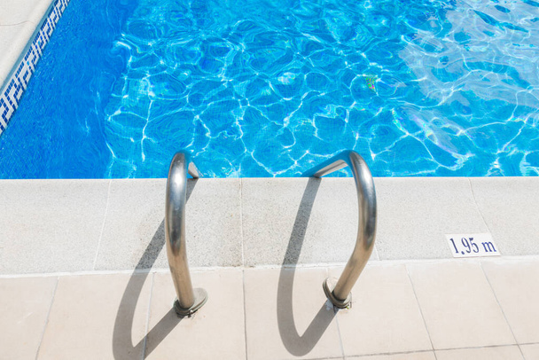 Swimming blue pool with stair  - Valokuva, kuva
