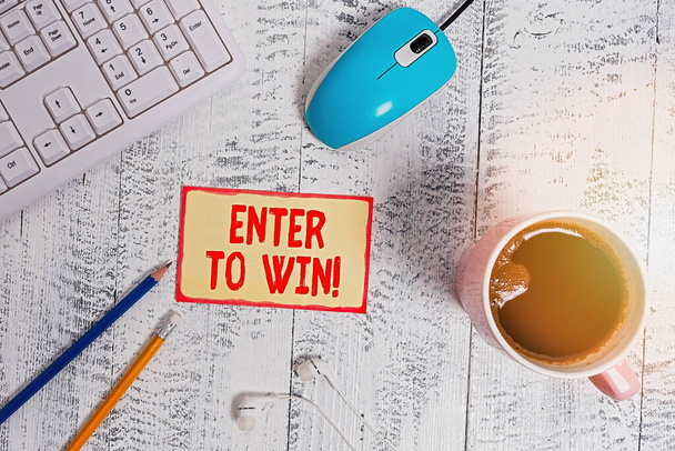 Text sign showing Enter To Win. Conceptual photo exchanging something value for prize chance winning prize technological devices colored reminder paper office supplies keyboard mouse. - Zdjęcie, obraz