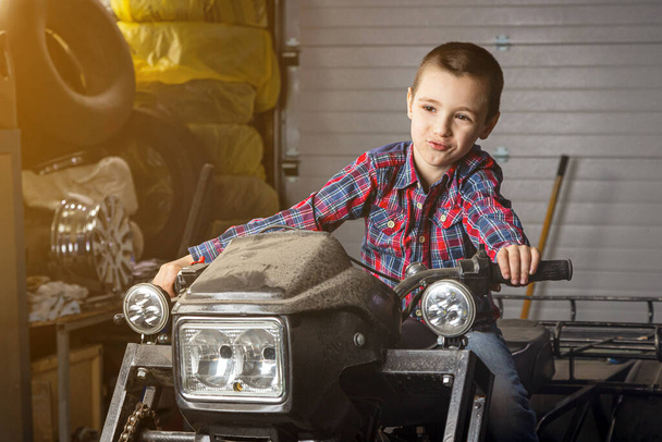 Little boy young auto mechanist cheerfully dreams that h - Photo, Image