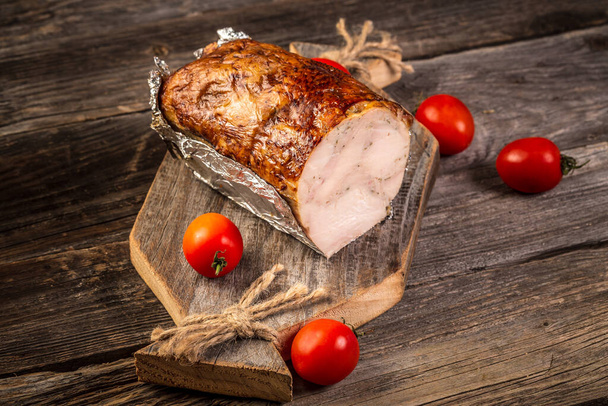 Home-made whole boiled chicken ham prepared by polish butcher. Part of ham Smoked whole Chicken. - Photo, Image