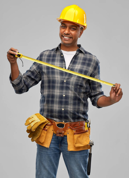 happy indian worker or builder with ruler - Foto, Imagem