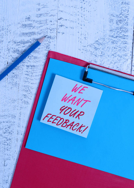 Writing note showing We Want Your Feedback. Business photo showcasing criticism given someone say can be done for improvement Clipboard blank paper sheet pencil notepad old retro wooden background. - Photo, Image