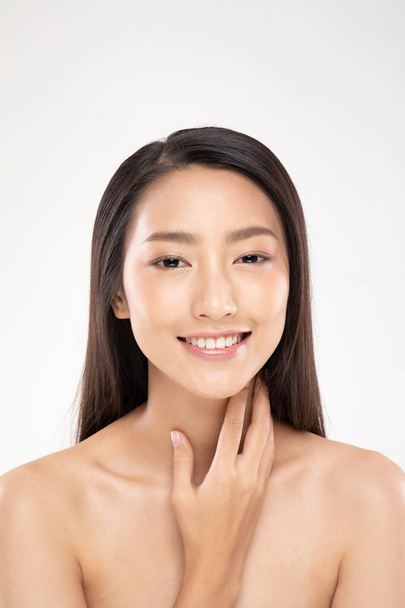 Beautiful Asian young woman touching neck smile with clean and fresh skin Happiness and cheerful with positive emotional,isolated on white background,Beauty and Cosmetics Concept - Fotó, kép
