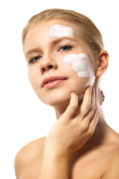 Woman applying moisturizer cream on face isolated - Фото, зображення
