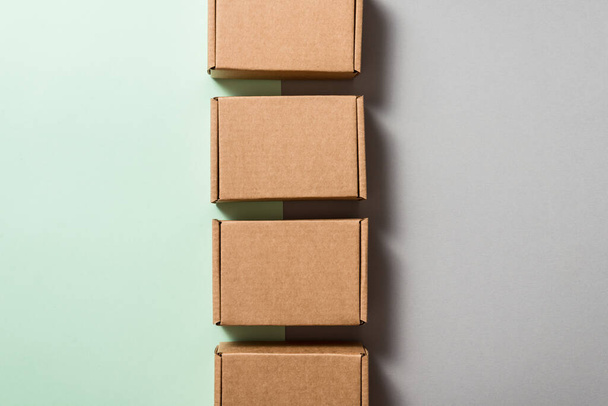 Set of brown carton boxes on blue background, copy space - Foto, afbeelding