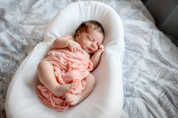 Newborn Baby in cocoon crib - Фото, зображення