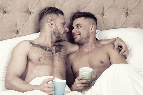 Young beautiful gay couple resting at home. Coffee. - Fotoğraf, Görsel