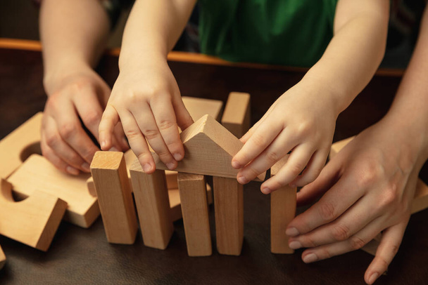 Close up of female and kids hands doing things together, family, home concept - 写真・画像