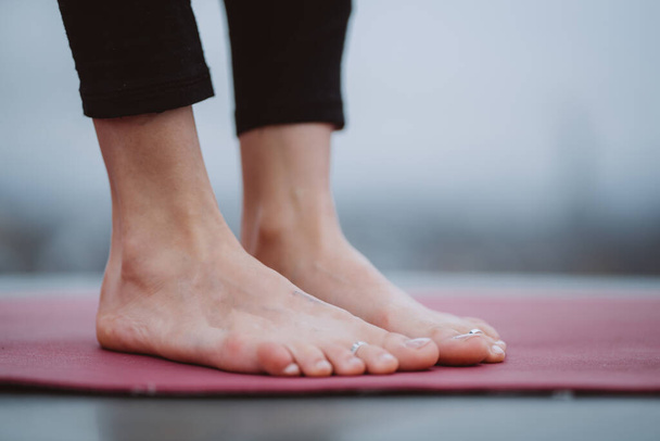 Close up detail of womans feet during yoga exercise. - Photo, Image