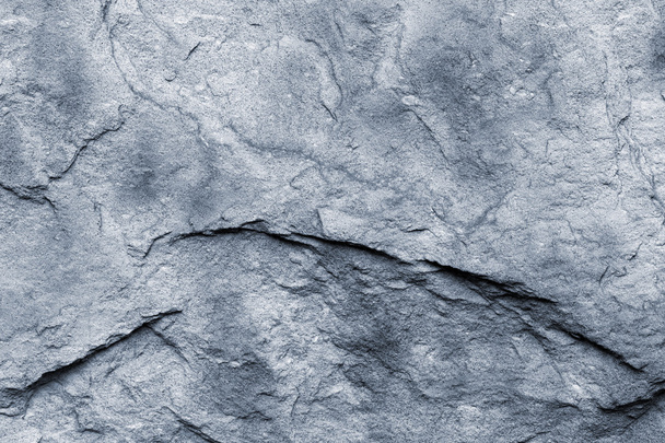 Close up of a blue-grey stone wall - 写真・画像