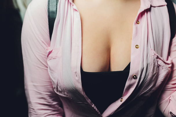 neckline, beautiful large female breast, dress, close-up. - Photo, image
