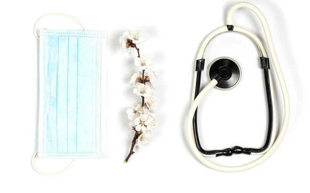 Medical mask for protection against viruses on a white background - 写真・画像