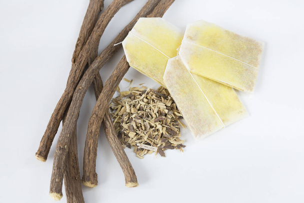 Licorice crumbled and roots together with turmeric sachets - Glycyrrhiza glabra - Photo, Image