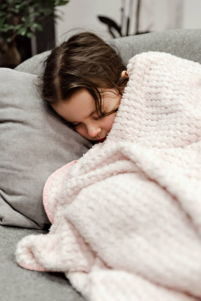 sleeping girl,sleeping little girl covered with a blanket,little girl sleeping in a chair,healthy sleep,beautiful girl covered with a blanket - Valokuva, kuva