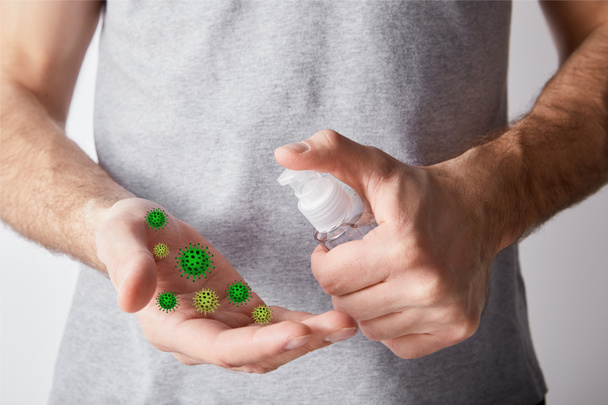 cropped view of adult man using hand sanitizer in dispenser bottle, bacteria illustration - Foto, Imagen