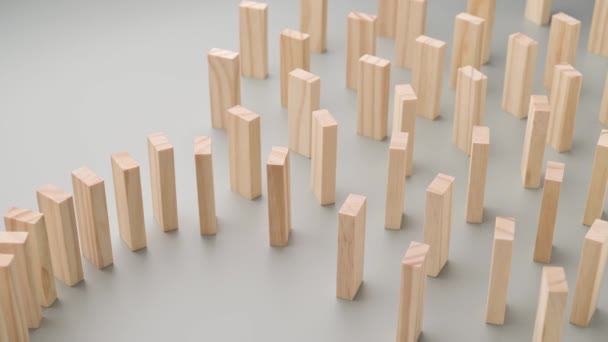 hand pushes dominoes, domino effect stops due to large distance - Footage, Video