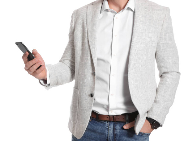 Businessman with smartphone on white background, closeup - Fotoğraf, Görsel