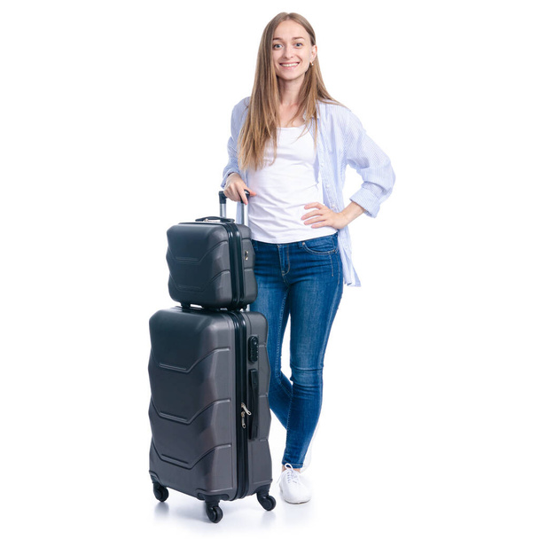 Woman with travel suitcase standing smiling - Photo, image