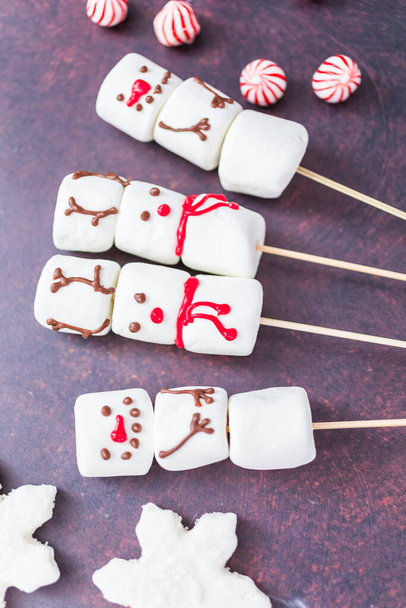 Close up view. Marshmallow snowmen and reindeer on sticks for hot chocate drink. - Φωτογραφία, εικόνα