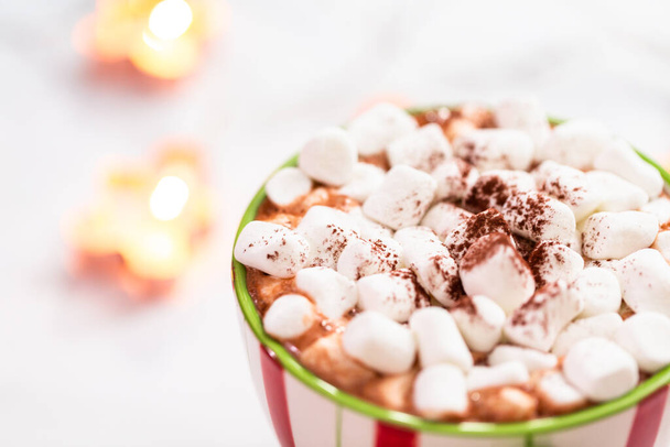 American hot chocolate with marshmallow toppings in large Christmas mug. - Fotografie, Obrázek