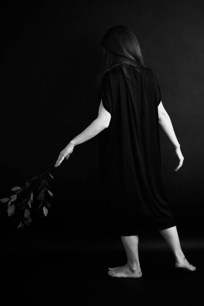 Black and white art fashion surrealistic portrait of beautiful woman,details of body black and white portrait of beautiful girl,fashion and art,portrait with plants and flowers - 写真・画像