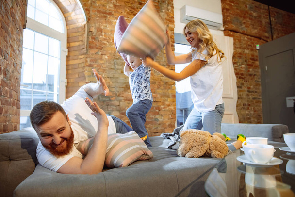 Mother, father and son at home having fun, comfort and cozy concept - Foto, immagini