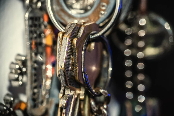 Extreme close up of metal keys hanging on the wall - Foto, Imagem