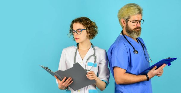 Live Longer. trust our professionals. healthcare business. teamwork and people concept. doctor and nurse. Successful team of medical doctors. People in uniforms blue background. Medical staff - Foto, Bild
