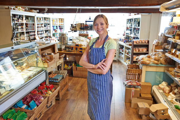 Portrait Of Female Owner Of Delicatessen Standing In Shop - Φωτογραφία, εικόνα