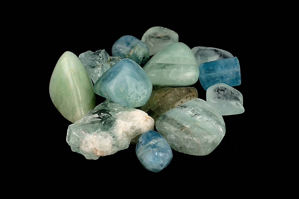 Aquamarine (from Latin: aqua marina, "sea water" is a blue or cyan variety of beryl. It occurs at most localities which yield ordinary beryl.  - Photo, Image