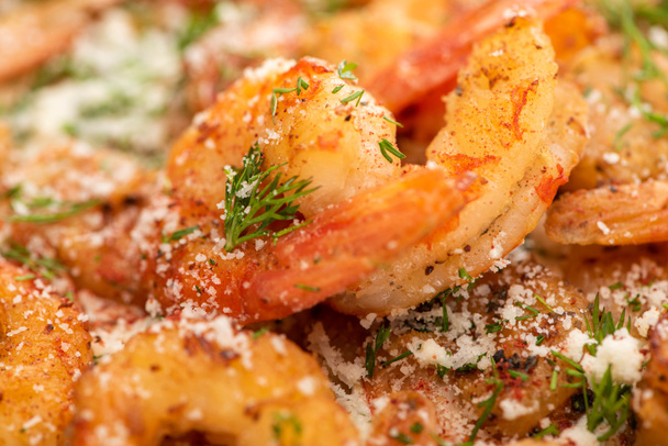 close up view of fried shrimps with dill and grated cheese - Valokuva, kuva
