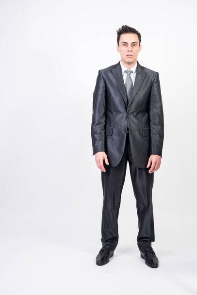 Man in suit in trance. White background, full body - Photo, Image