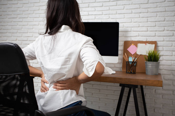 Business woman suffering from back pain in office home - Φωτογραφία, εικόνα