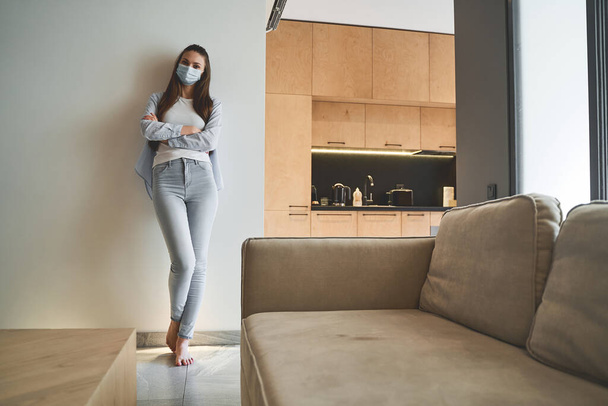 Young female under quarantine staying at home - 写真・画像