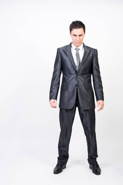 Seductive man in suit. White background, full body - Foto, afbeelding