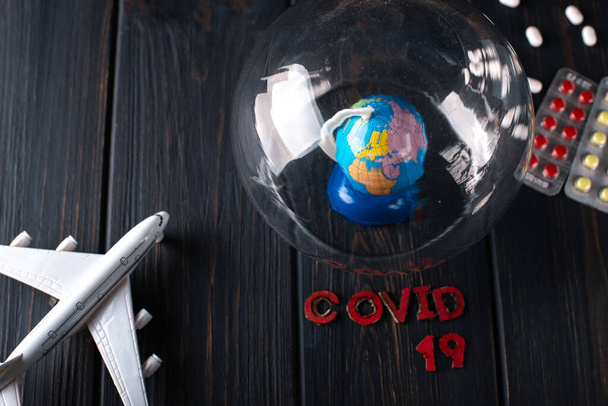 Earth under a glass bell. Quarantine, pandemic concept in the world COVID-19 - Photo, Image