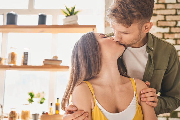 Tender young female person kissing her man - Foto, Imagem