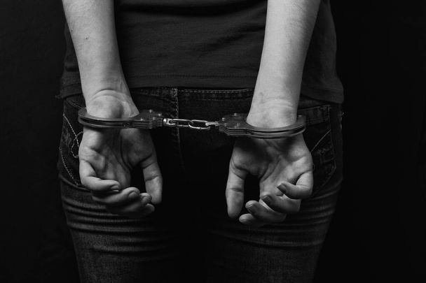 women cuffed hands together - Photo, Image