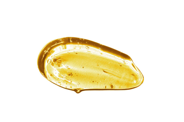 Ορός βιταμίνης C, υφή καλλυντικού τζελ. Διαφανές κίτρινο τζελ με φυσαλίδες σε όμορφο λεκέ - Φωτογραφία, εικόνα