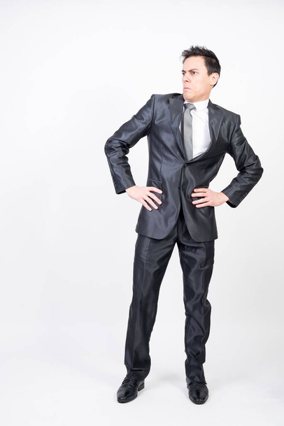 Surprised man in suit. White background, full body - Photo, Image