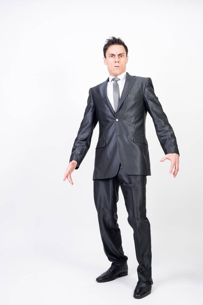 Surprised man in suit. White background, full body - Zdjęcie, obraz