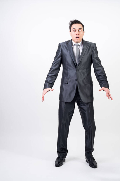 Scared man in suit on white background, full body - Foto, immagini