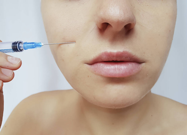 beautiful girl face syringe skin care - Valokuva, kuva