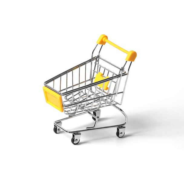 empty shopping trolley isolated on white background. close-up of shopping cart on white background with some copy space - Φωτογραφία, εικόνα