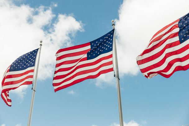 American flag on the blue sky. - Zdjęcie, obraz