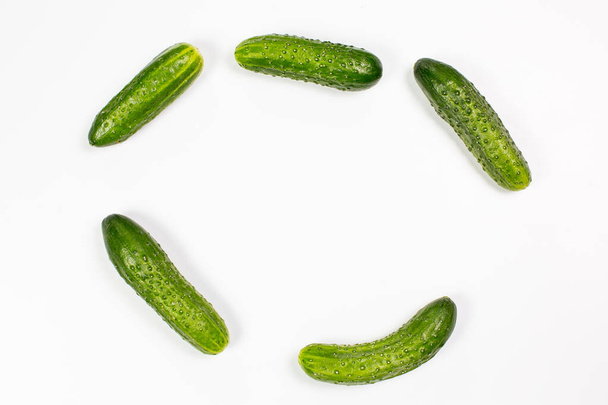 Fresh green cucumbers on a white background - Photo, Image