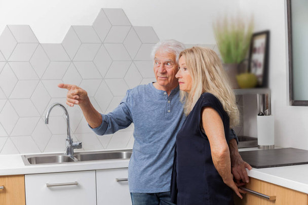 Senior couple in a kitchen - Photo, Image