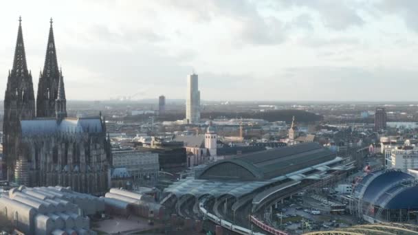 AERIAL: Circling around Beautiful Cologne Cathedral with Central Train Station in beautiful hazy Sunlight  - Footage, Video