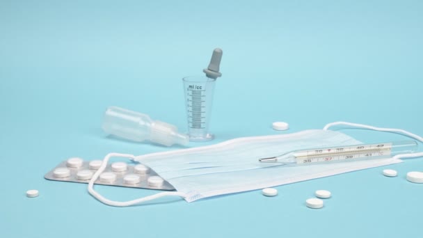 Medical accessories and medicines on a blue background. - Footage, Video