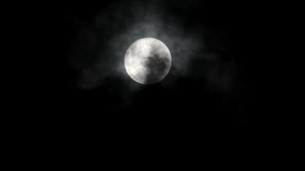 The supermoon is the largest full moon seen surrounded by black clouds - Footage, Video